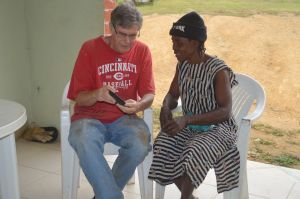 The author sharing photos of the early volunteers with Adele