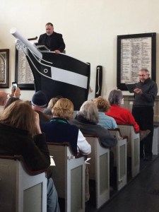 Reading from the pulpit at Seamen's Bethel.